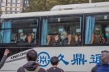 Covid-19: les experts de l’OMS sortent de quarantaine pour leur enquête à Wuhan